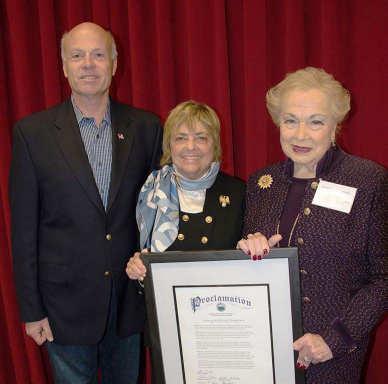 Freeholder Director Lillian G. Burry and Deputy Director Gary J. Rich, Sr., present Renee Swartz with a proclamation